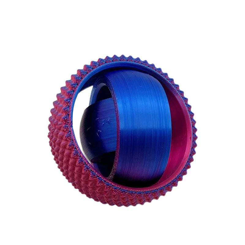A person's fingers gently manipulating the rings of the sensory fidget ball
