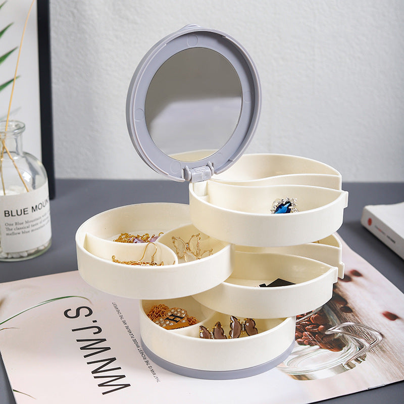 Top-down view of a round, 4-layer rotatable jewelry organizer, offering ample accessory storage