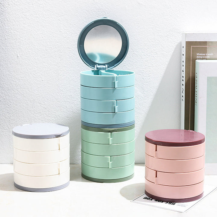 Unisex 4-layer rotatable jewelry storage box in a modern setting, a sleek home decor piece
