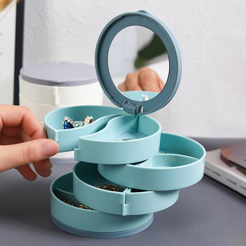 White 4-layer rotatable jewelry organizer, demonstrating its compact design for desktop storage