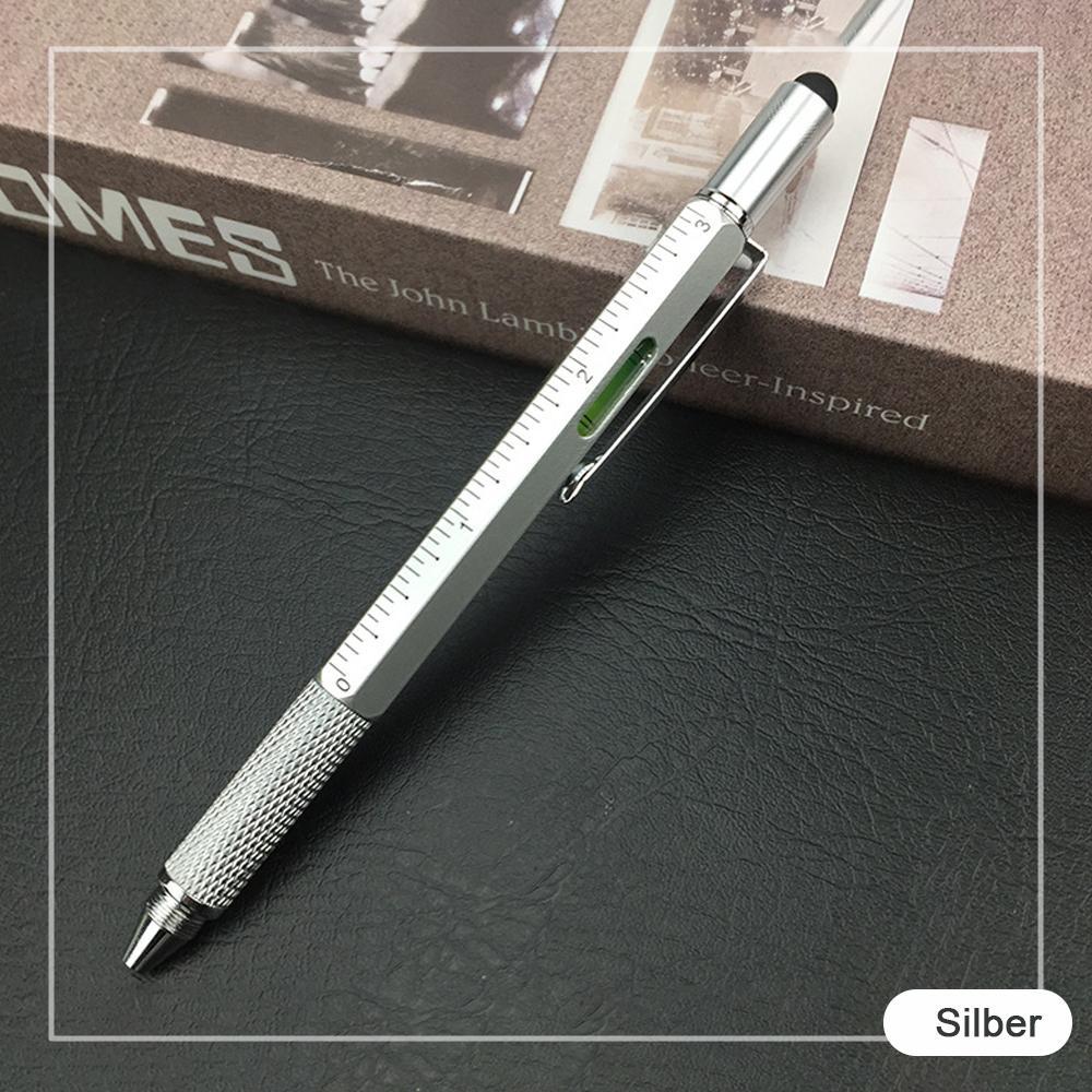 Unisex multifunction pen placed next to a notebook, illustrating its writing and tool capabilities.