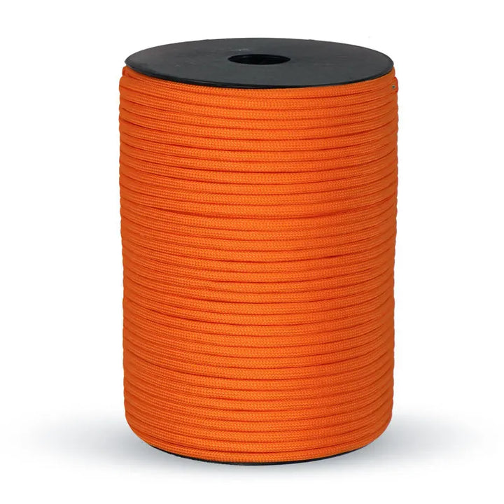 Durable 550 paracord rope, 9-strand, securing camping gear or used for hiking and survival tasks.
