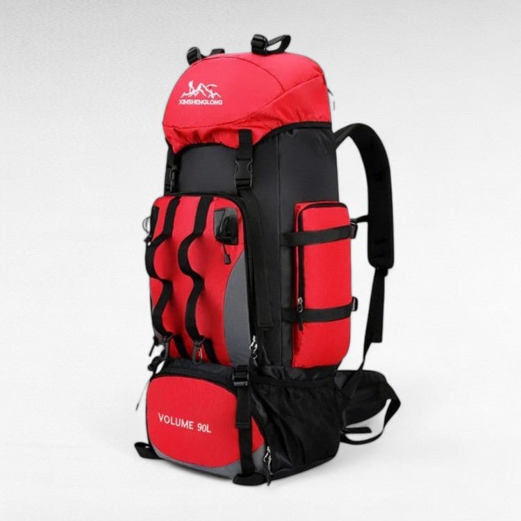 Hiker wearing a lightweight 90L waterproof trekking backpack on a trail, ready for outdoor adventure.