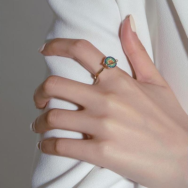 Collection of three unisex adjustable spinning galaxy fidget rings in various sizes, for anxiety and stress relief