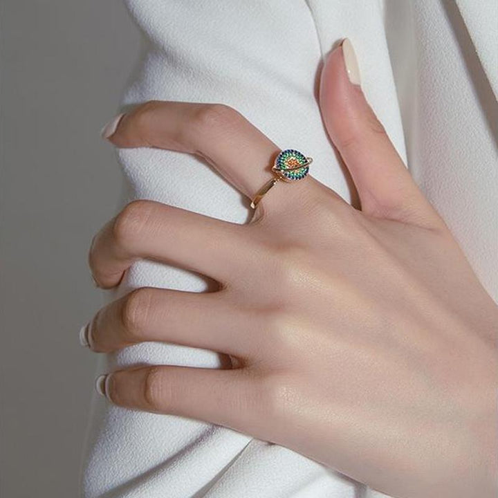 Collection of three unisex adjustable spinning galaxy fidget rings in various sizes, for anxiety and stress relief