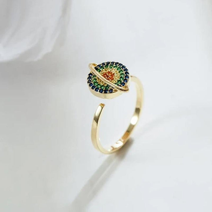 Detailed shot of the spinner mechanism on an adjustable galaxy fidget ring, emphasizing its stress-relieving function