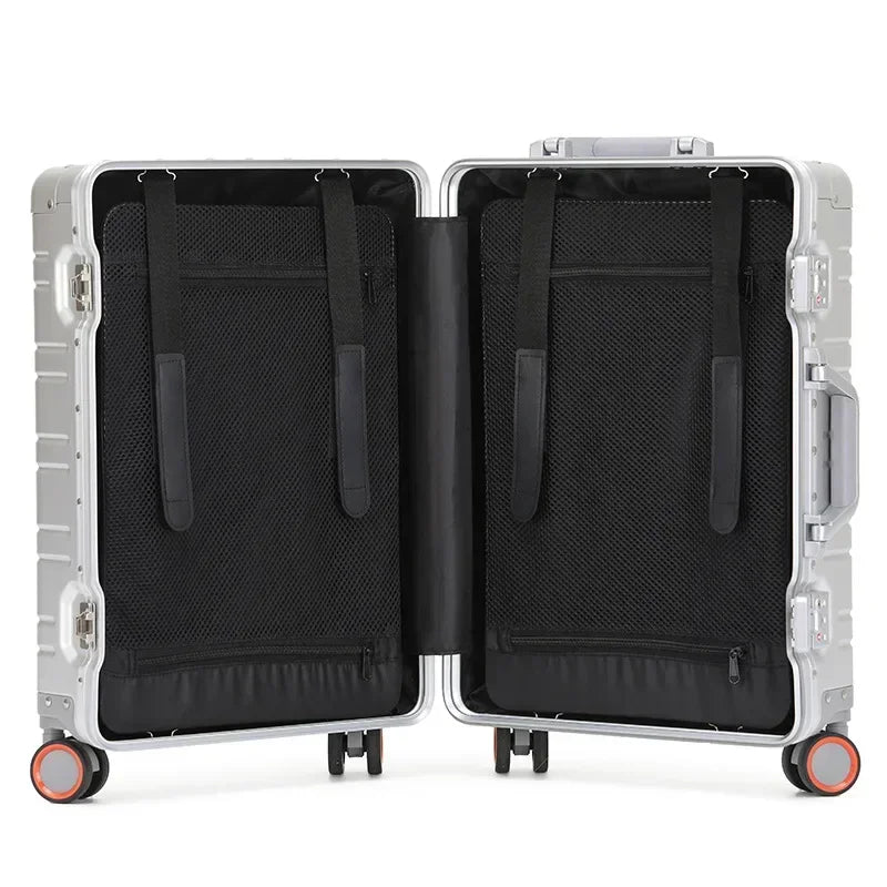 Ergonomic telescopic handle extended on a modern unisex aluminum-magnesium travel suitcase.