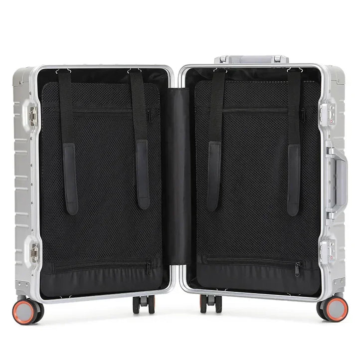 Ergonomic telescopic handle extended on a modern unisex aluminum-magnesium travel suitcase.