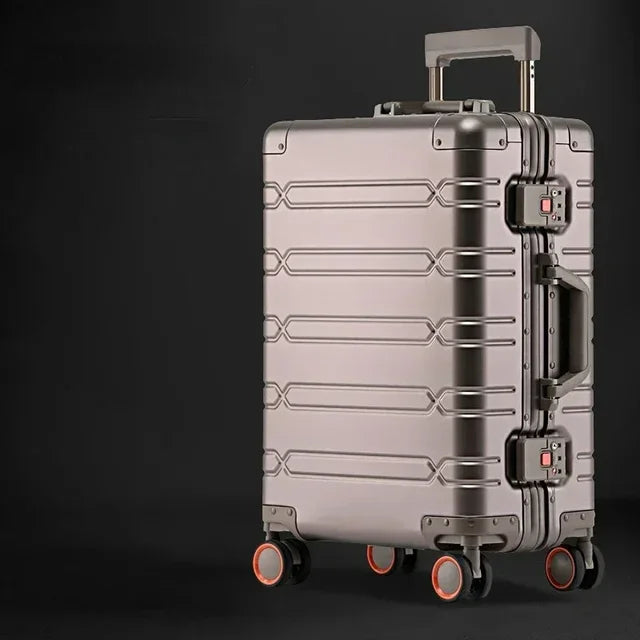 Unisex aluminum-magnesium hard shell luggage rolling smoothly through an airport terminal.