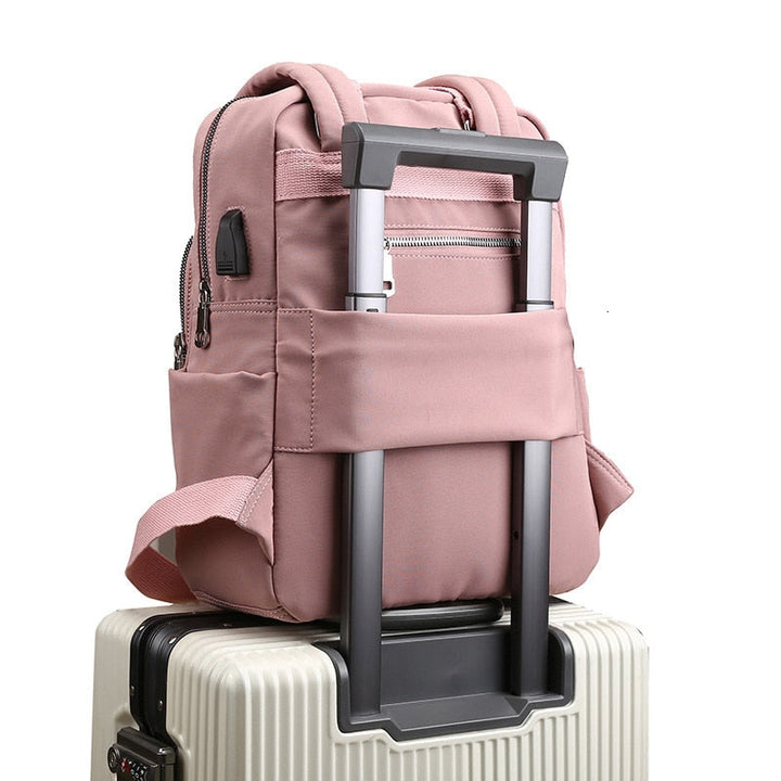 Unisex anti-theft backpack, water-resistant, with USB charging port. Perfect for daily use & travel.