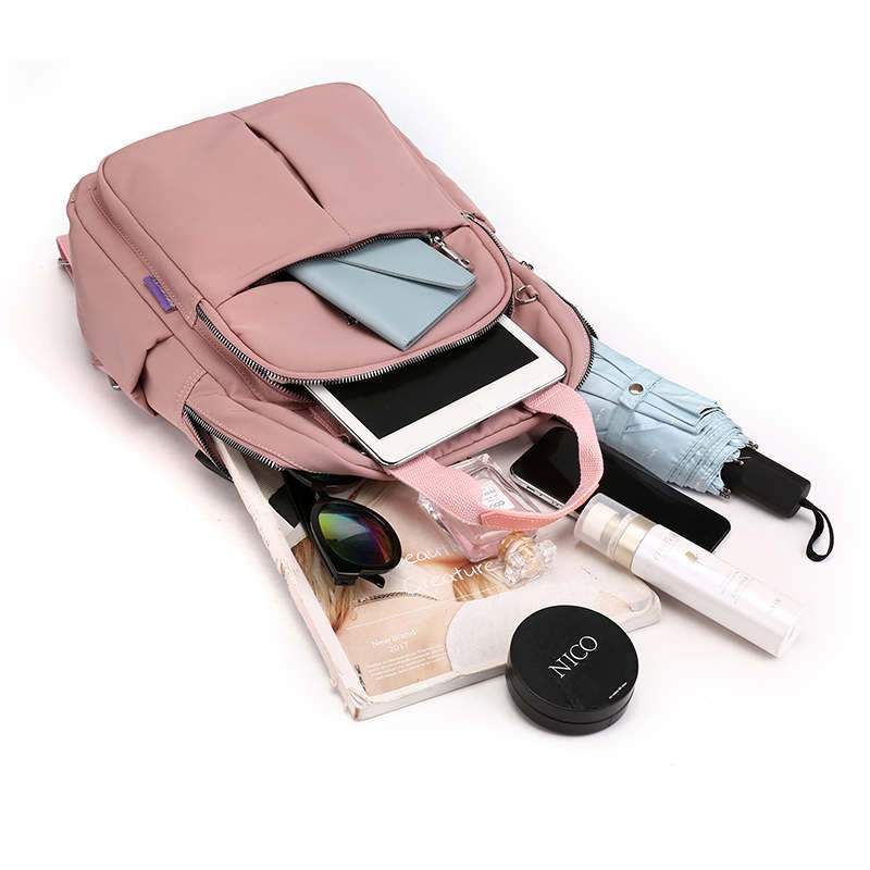 Organized multi-compartment anti-theft backpack, water-resistant, with convenient USB charging.