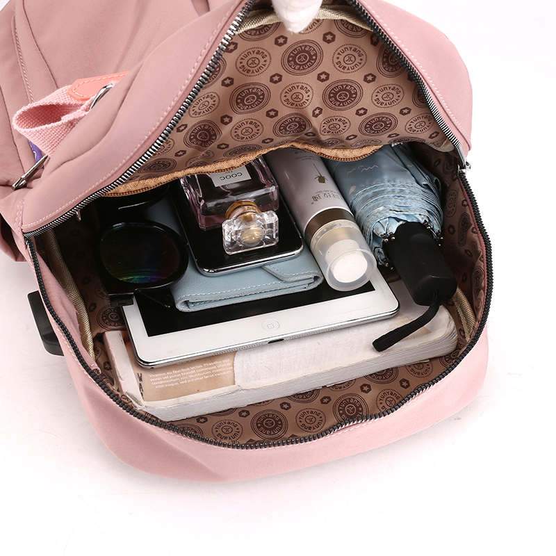 Anti-theft backpack with secure hidden zippers, water-resistant fabric, and integrated USB charger.