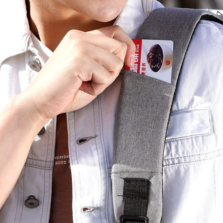Sleek unisex anti-theft laptop backpack, water-resistant, with USB charge port, ideal for modern daily carry.