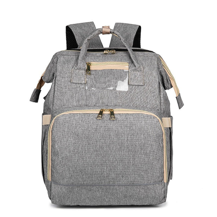 Convenient convertible diaper backpack & portable bassinet, perfect travel gear for busy parents.