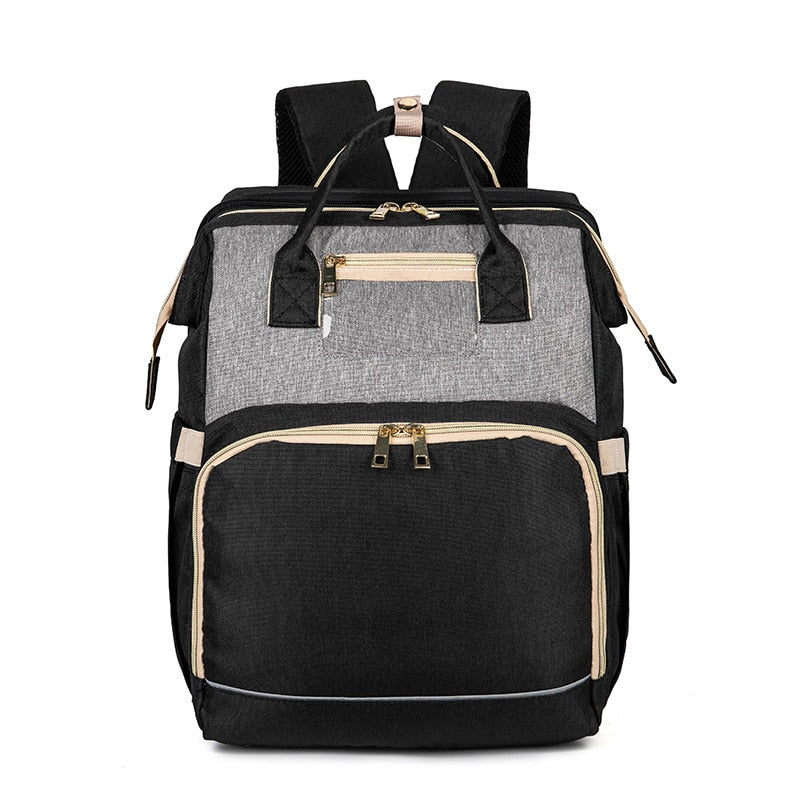 Foldable baby bassinet extended from a versatile nappy backpack, offering safe rest on the go.