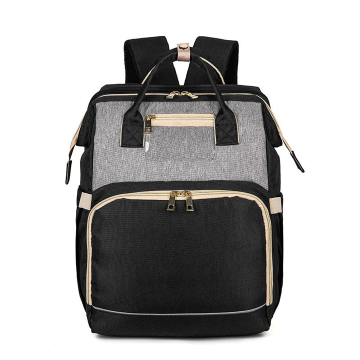 Foldable baby bassinet extended from a versatile nappy backpack, offering safe rest on the go.