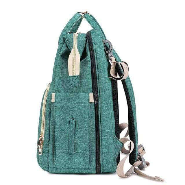 Essential parenting gear: a convertible diaper backpack with a foldable bassinet for active families.