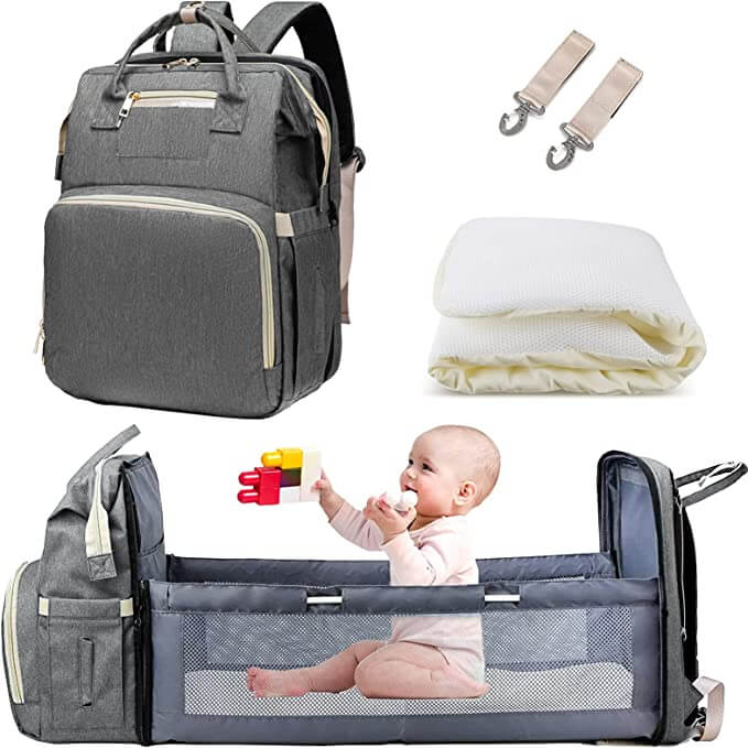 Outdoor-ready waterproof baby backpack with integrated portable bassinet, perfect for picnics.