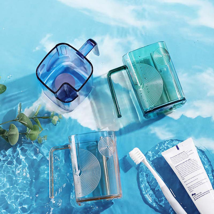 Ergonomic gargle cup featuring a toothbrush holder, a key home essential for organized bathroom hygiene