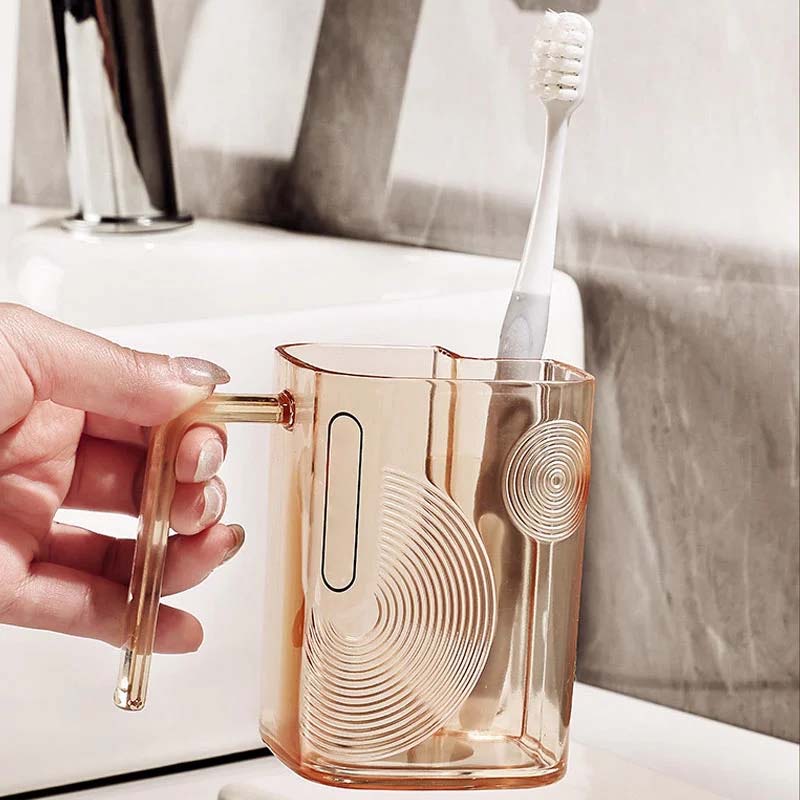 Set of different colored rinse cups each with an integrated toothbrush holder, ideal for family bathrooms