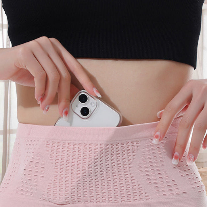 Model wearing a black concealed sports waist bag, demonstrating its slim profile for running and travel.