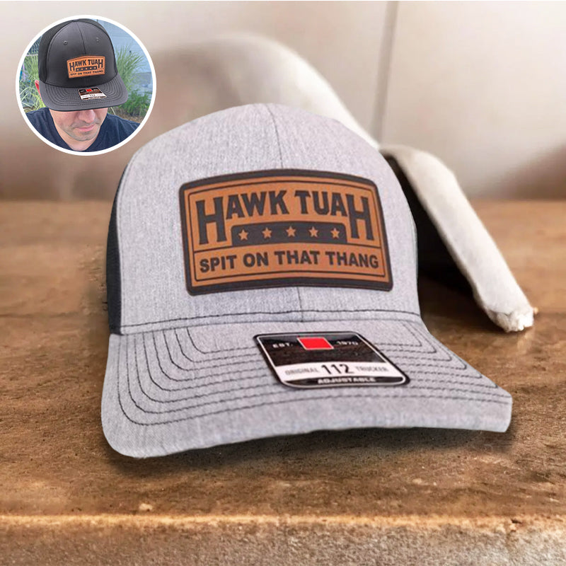 Stack of black and grey adjustable cotton baseball caps, ready for bulk purchase