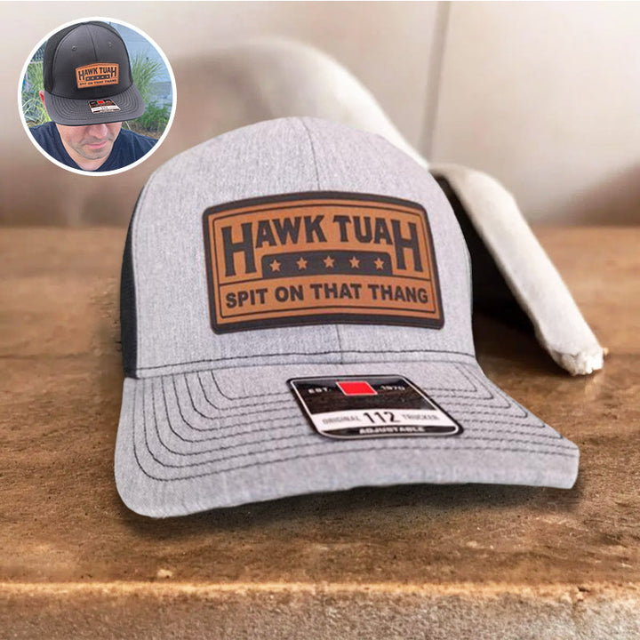 Stack of black and grey adjustable cotton baseball caps, ready for bulk purchase