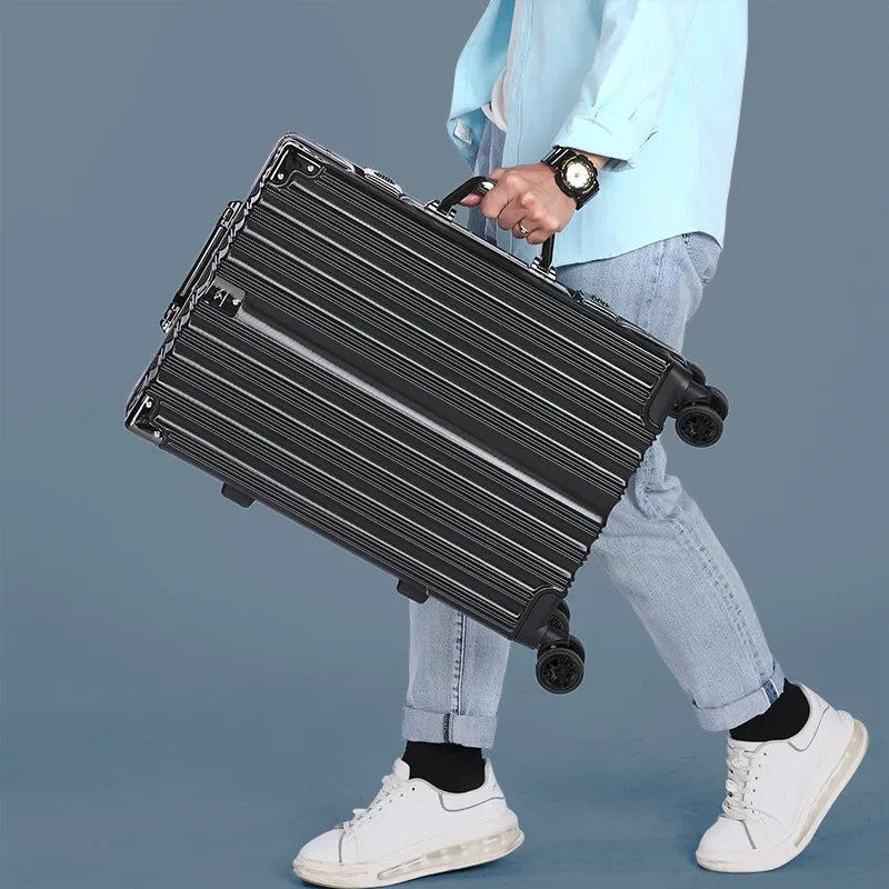 Close-up of secure aluminum frame on black hardshell luggage, featuring TSA-approved latch locks.