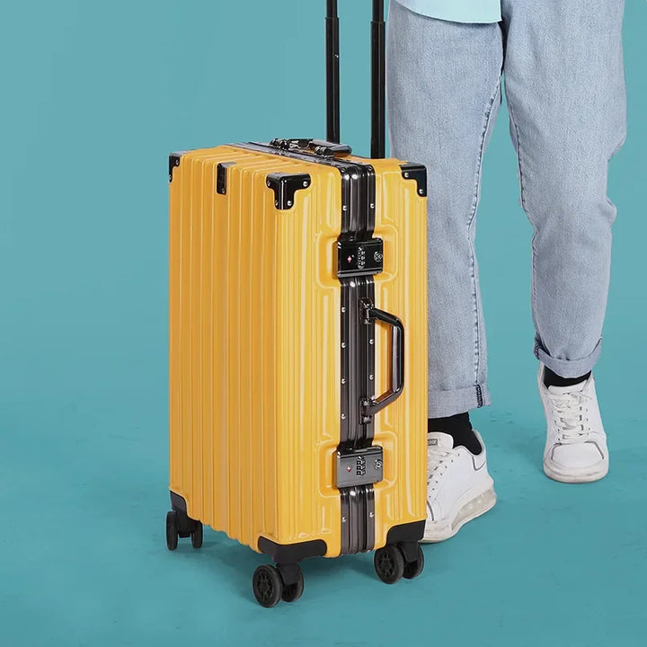 Modern black hardshell rolling suitcase, unisex, with sturdy aluminum frame & multi-directional spinner wheels.