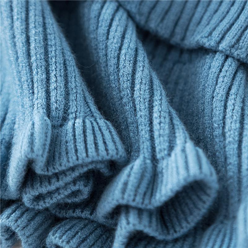 Knit dickey collar on a mannequin, highlighting its comfortable false collar design
