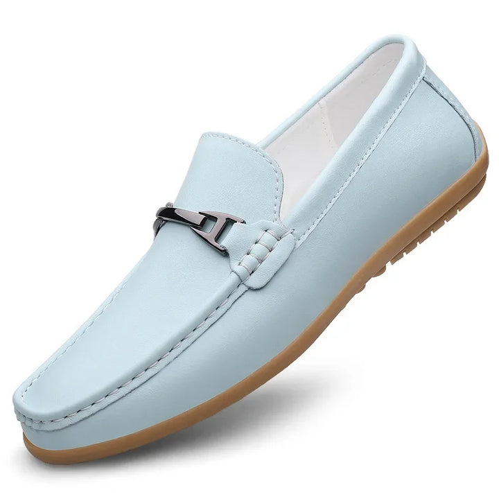 Detail of the sole of a unisex leather loafer, showing durable construction and grip.