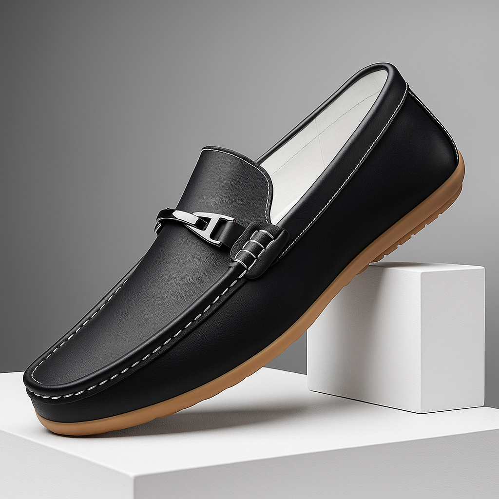 Pair of unisex leather loafers in a dark brown color, suitable for formal or casual wear.