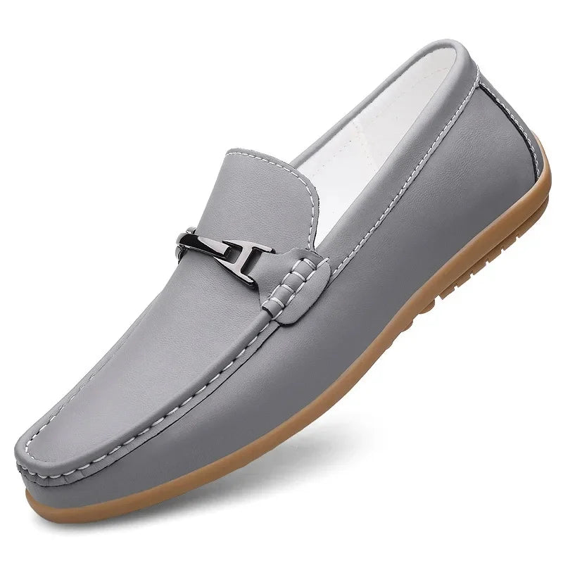 Top-down view of unisex black leather loafers, perfect for slip-on convenience and style.
