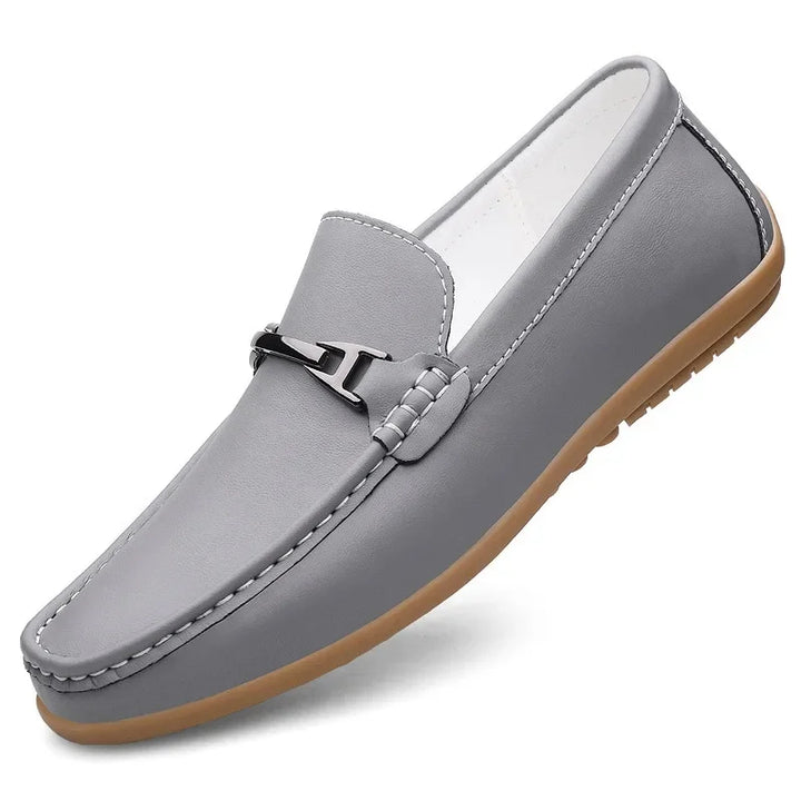 Top-down view of unisex black leather loafers, perfect for slip-on convenience and style.