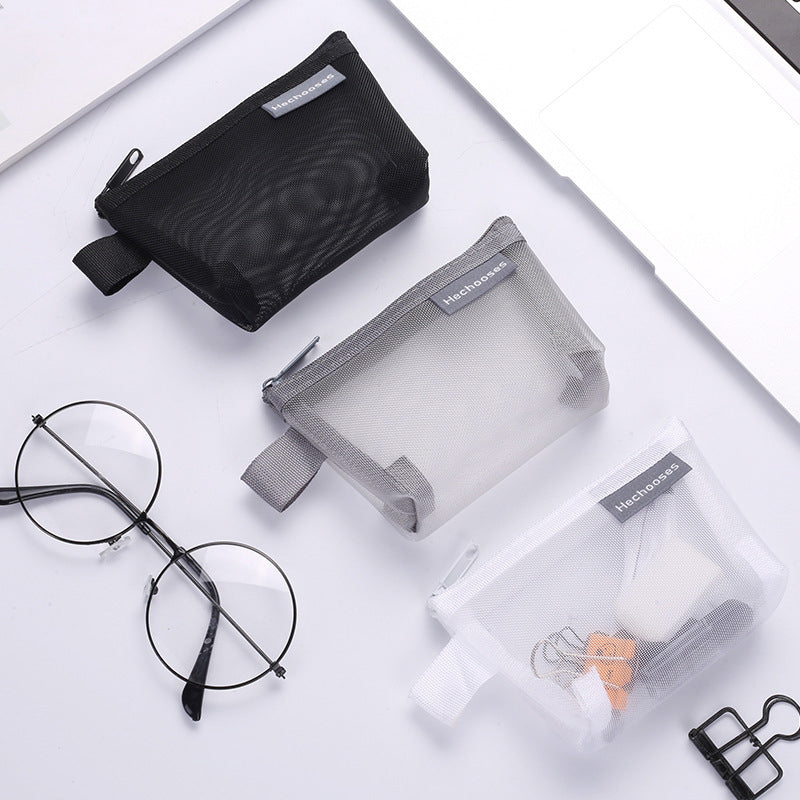 Unisex black mesh zipper pouch, perfect for organizing small travel essentials and cosmetics.