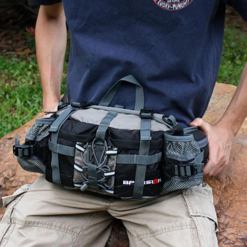 Woman wearing a black sling bag across back, ideal for daily commutes, hiking & outdoor adventures.