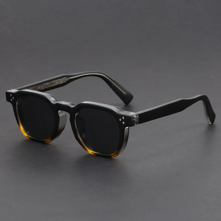 Close-up of unisex bold square sunglasses showing acetate frame detail and UV protection.