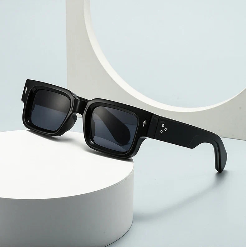 Modern unisex rectangular sunglasses featuring dark lenses and UV protection