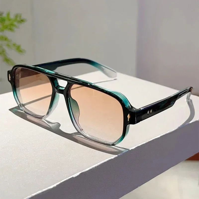 Bold rectangular UV400 sunglasses, black frame detail, a must-have accessory