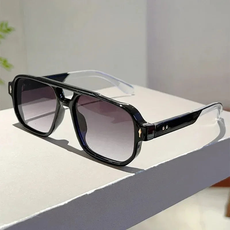 Side profile of unisex rectangular UV400 sunglasses, showcasing frame thickness