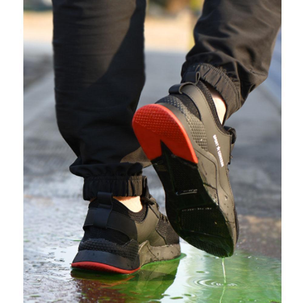 Detail of the anti-slip tread on breathable unisex safety work shoes, ensuring secure footing in wet conditions