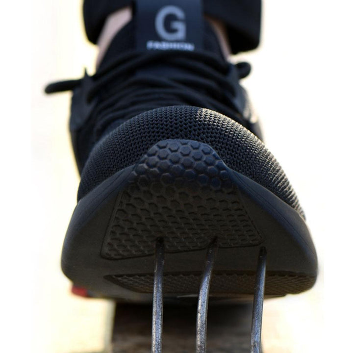 Action shot of unisex worker wearing breathable safety work shoes on a construction site, emphasizing utility