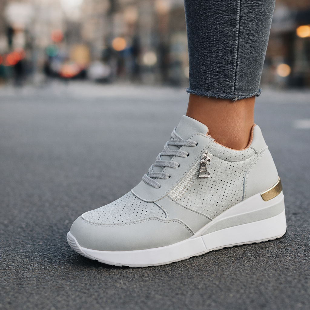 Side view of a lightweight unisex sneaker with a convenient zip, showcasing its breathable design