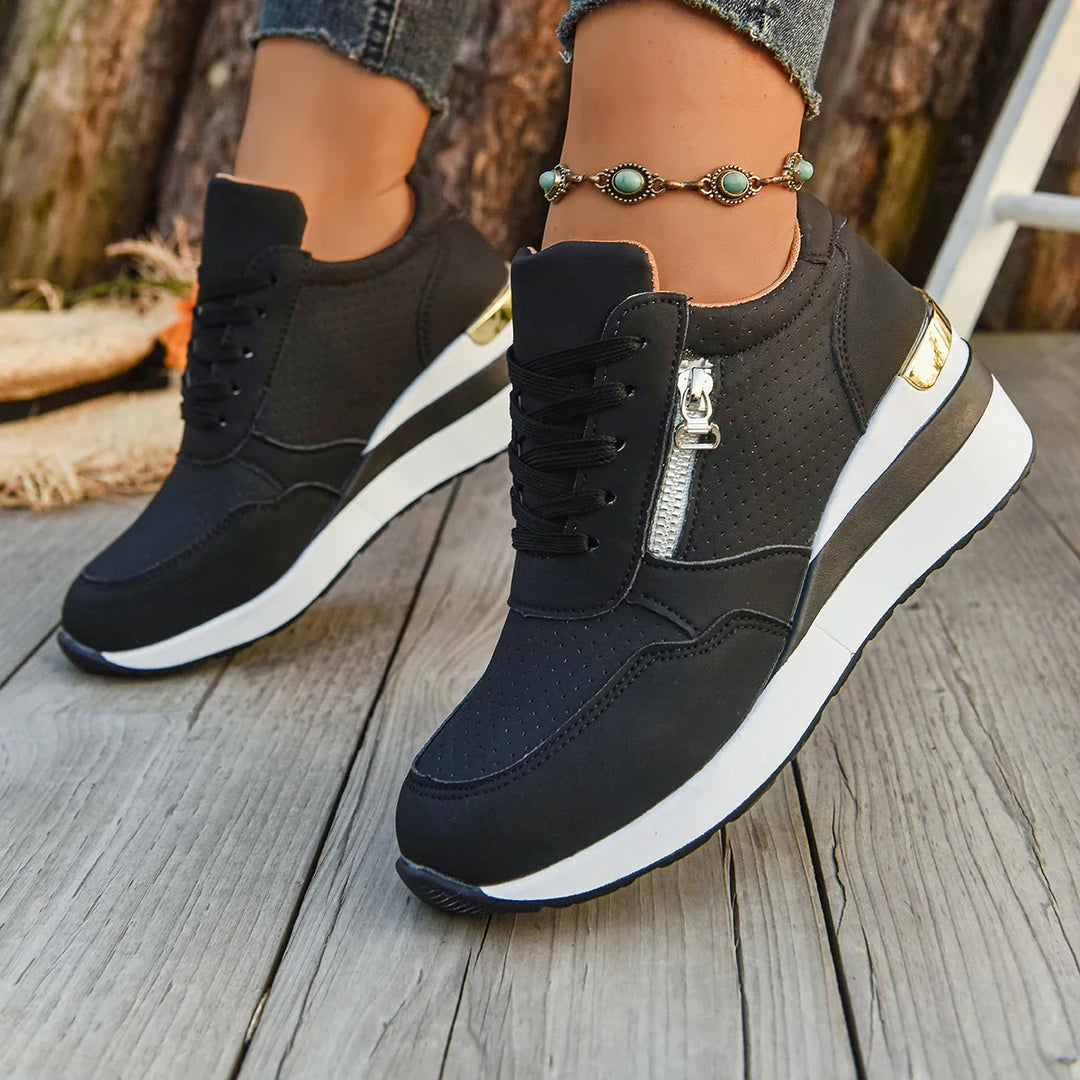 Pair of casual unisex sneakers featuring a unique zip and breathable upper for ultimate comfort