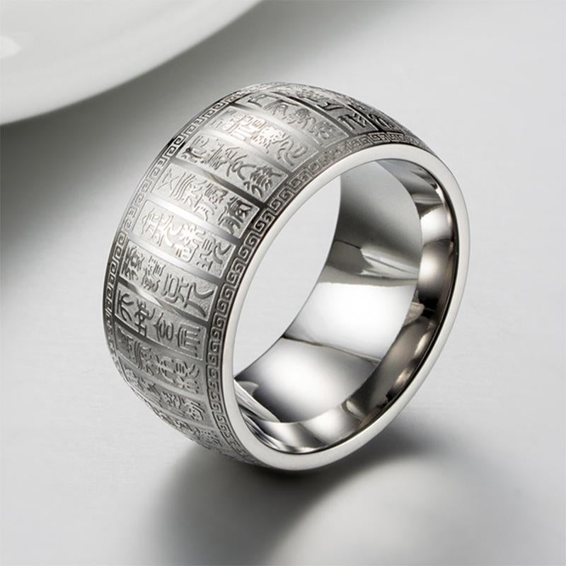 Close-up of a golden titanium ring with clear Buddhist mantra inscription, ideal spiritual gift
