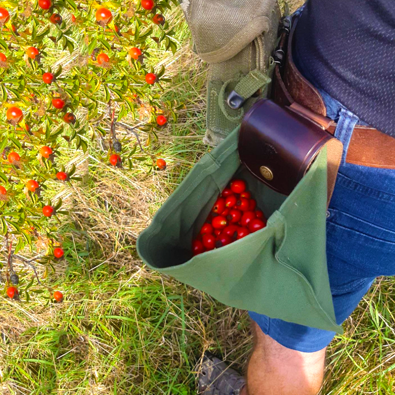 Unisex canvas and leather foraging pouch with rolled-up design, perfect for bushcraft and outdoor gear.