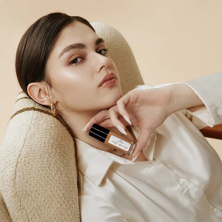 Collection of Captivating Roll-On Fragrance Oils, featuring the peach and vanilla blend for lasting attraction.