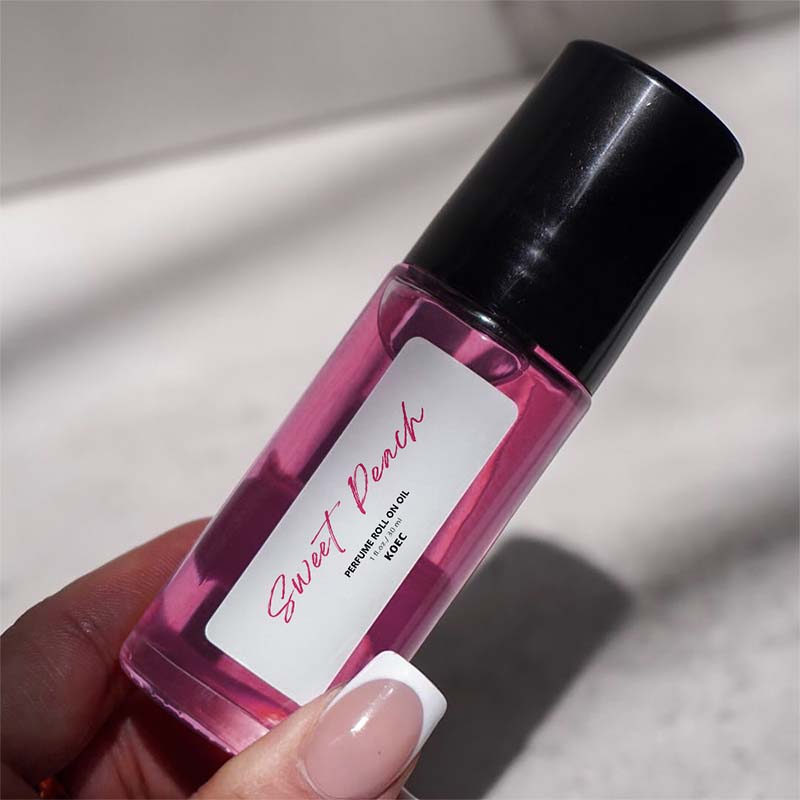 Elegant roll-on fragrance oil, peach and vanilla scented, designed for capturing attention and boosting confidence.