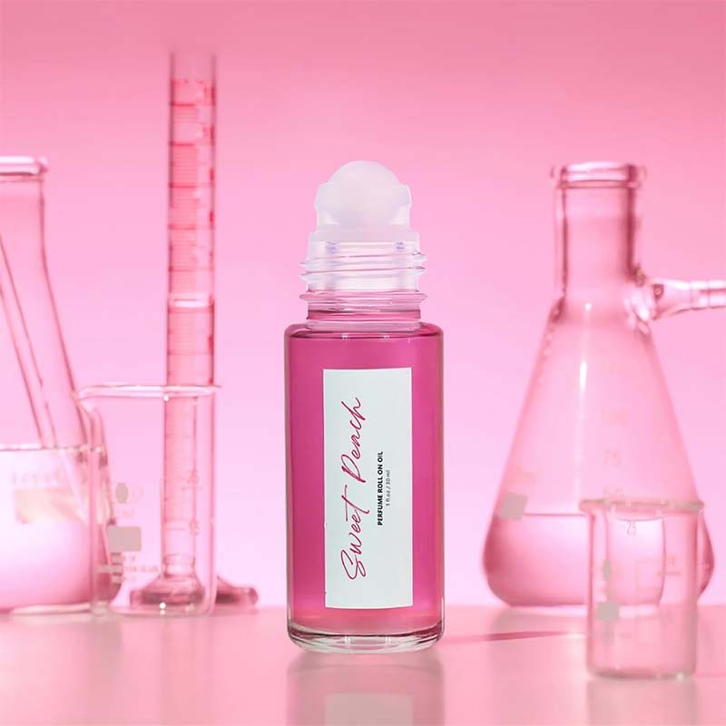 Aromatherapy-inspired Captivating Roll-On Fragrance Oil with sweet peach and warm vanilla essence for confidence.