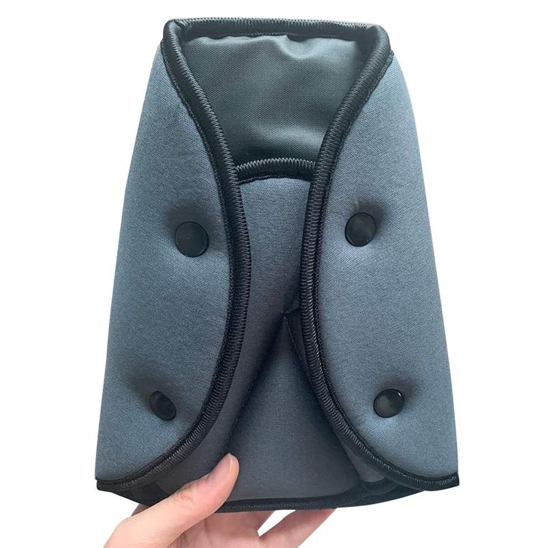 Hands adjusting a car seat belt with the adjuster for improved travel comfort, safety accessory.
